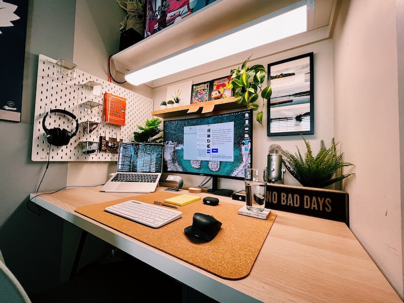 A desk with multiple devices arranged for maximum productivity